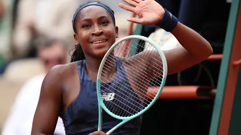 Coco Gauff celebrates after winning at the Roland Garros