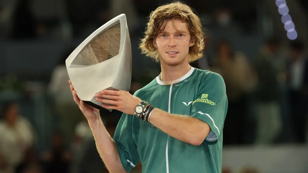 Andrey Rublev lifts the Mutua Madrid Open trophy following victory in the Men’s Singles Final match against Felix Auger-Aliassime on Day Thirteen of Mutua Madrid Open in 2024. (Source: Clive Brunskill/Getty Images)