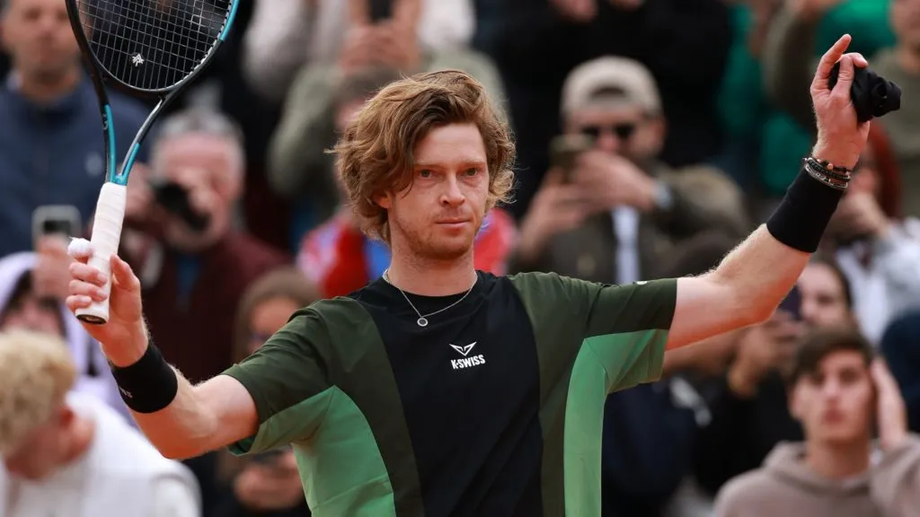 Andrey Rublev acknowledges the crowd as he celebrates his victory over Lloyd Harris of South Africa i the Men’s Singles First Round match during Day Three of the 2025 French Open. (Source: Clive Brunskill/Getty Images)