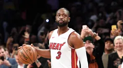 Dwyane Wade #3 of the Miami Heat dribbles the ball in the final seconds of the second half of the game against the Brooklyn Nets