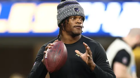Lamar Jackson #8 of the Baltimore Ravens warms up prior to the game against the Los Angeles Chargers at SoFi Stadium on November 26, 2023 in Inglewood, California.
