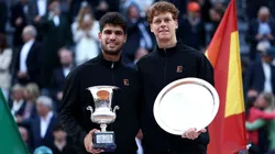 Carlos Alcaraz of Spain poses with the trophy as he celebrates victory alongside runner up Jannik Sinner of Italy following the Rome Open final.