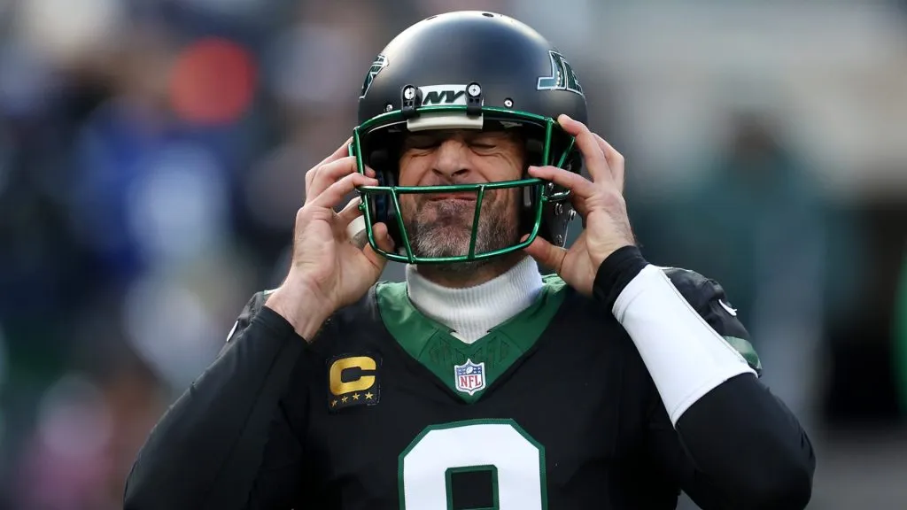 Aaron Rodgers #8 of the New York Jets puts on his helmet during the first quarter of a game against the Seattle Seahawks at MetLife Stadium on December 01, 2024 in East Rutherford, New Jersey.