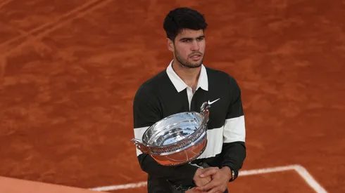 Carlos Alcaraz of Spain holds the Coupe des Mousquetaires trophy following his victory over Jannik Sinner of Italy in the Menβs Singles Final match on Day Fifteen of the 2025 French Open at Roland Garros on June 08, 2025 in Paris, France.