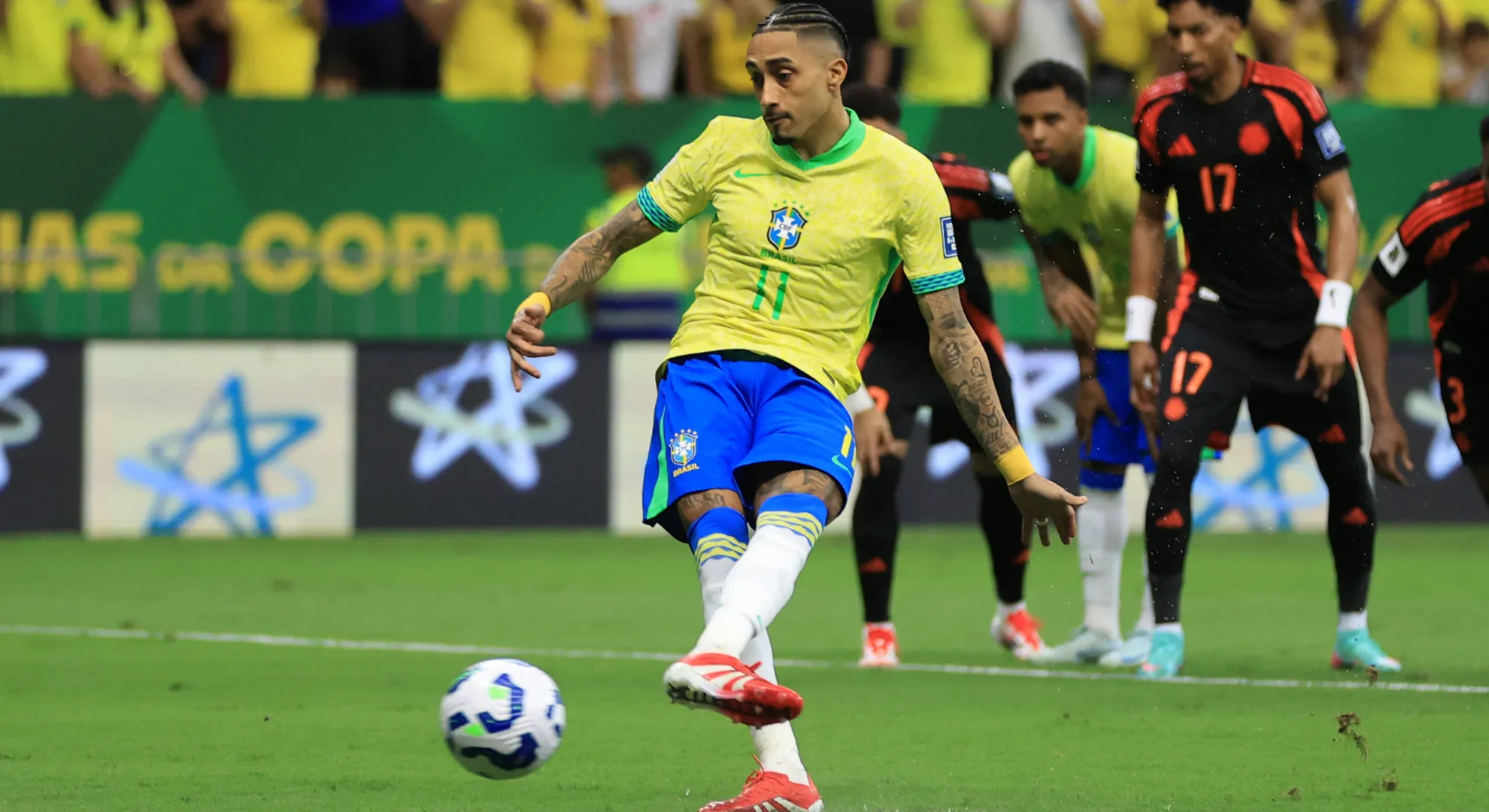Raphinha of Brazil takes a penalty.