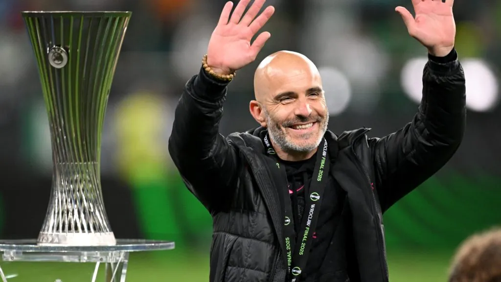 Enzo Maresca, Manager of Chelsea, acknowledges the fans as he walks past the UEFA Conference League trophy following his team’s victory in the UEFA Conference League Final 2025. (Source: Stuart Franklin/Getty Images)