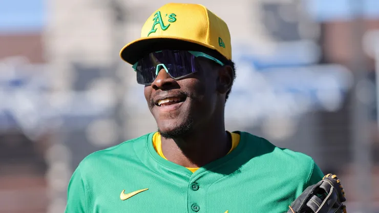 Denzel Clarke #16 of the Athletics smiles as he runs to the dugout after he made two catches on fly balls in the seventh inning, including one hit by Ryan Waldschmidt # 21 of the Arizona Diamondbacks to the center field wall, during a spring training game at Las Vegas Ballpark on March 09, 2025 in Las Vegas, Nevada. The Diamondbacks defeated the Athletics 7-5.