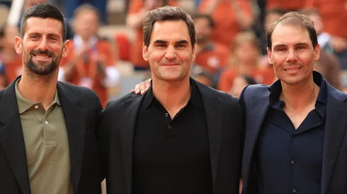 Rafael Nadal poses for a photo with Roger Federer and Novak Djokovic on Court Philippe-Chatrier.
