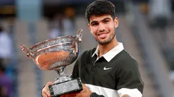 Carlos Alcaraz of Spain with the Coupe des Mousquetaires trophy following his victory over Jannik Sinner in the Roland Garros final.