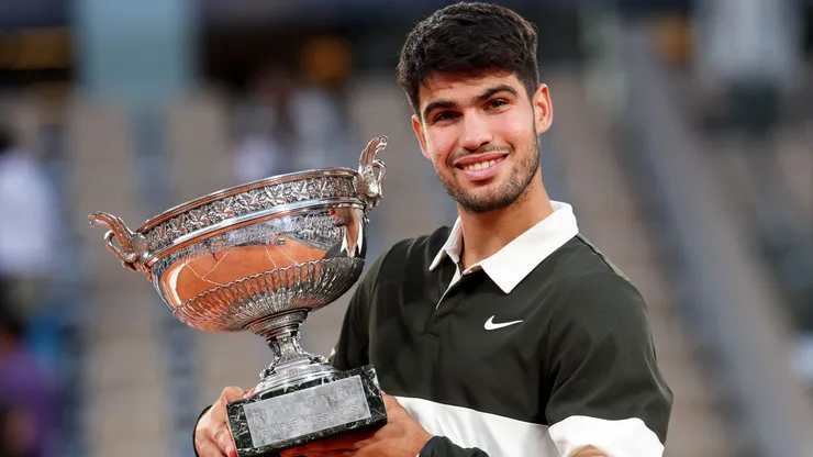 Carlos Alcaraz of Spain with the Coupe des Mousquetaires trophy following his victory over Jannik Sinner in the Roland Garros final.