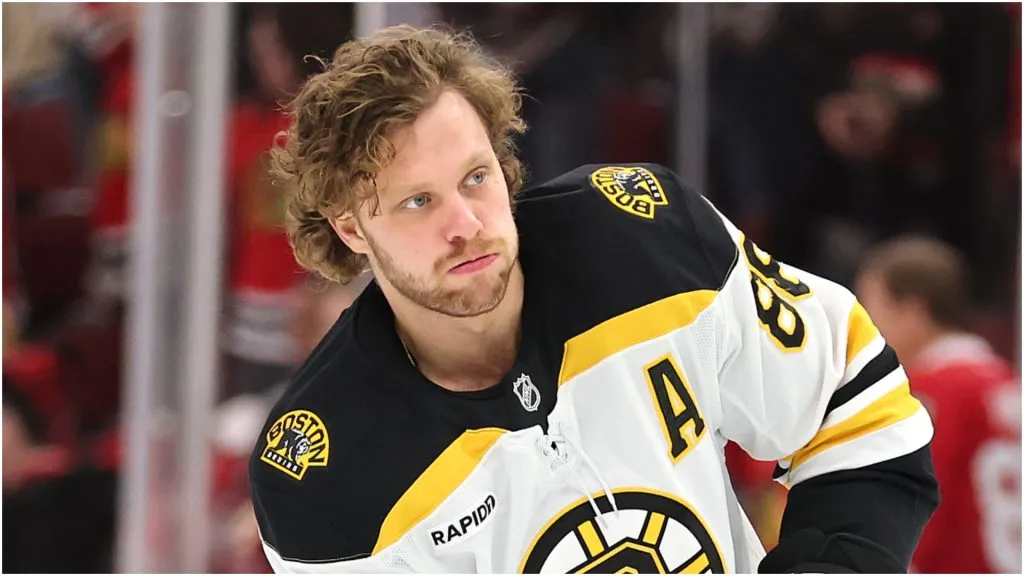 David Pastrnak #88 of the Boston Bruins warms up prior to the game against the Chicago Blackhawks at the United Center on December 04, 2024 in Chicago, Illinois.