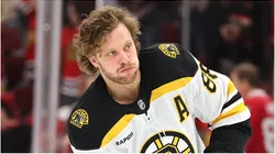 David Pastrnak #88 of the Boston Bruins warms up prior to the game against the Chicago Blackhawks at the United Center on December 04, 2024 in Chicago, Illinois.
