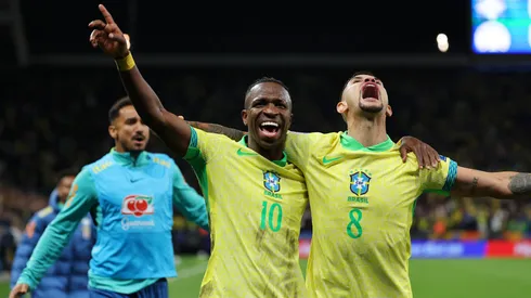 Vinicius Junior celebrates with Bruno Guimaraes after scoring Brazil's first goal during the FIFA World Cup 2026 South American Qualifier vs Paraguay