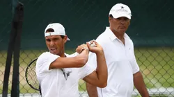 Rafael Nadal of Spain plays a backhand in a training session with coach and uncle Toni Nadal at Wimbledon on July 9, 2017 in London, England.