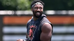 Myles Garrett #95 and Shelby Harris #93 of the Cleveland Browns walk off the field after Cleveland Browns mandatory minicamp at CrossCountry Mortgage Campus on June 11, 2025 in Berea, Ohio.