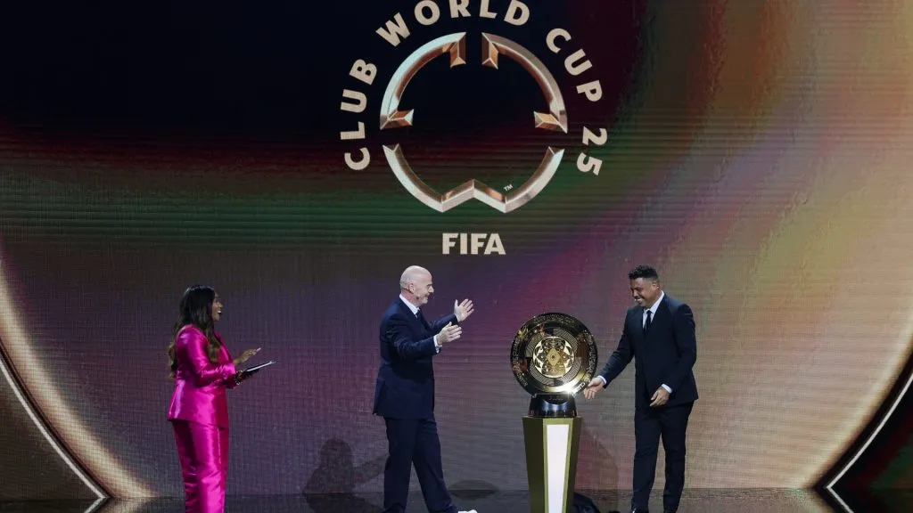 President Gianni Infantino presents The FIFA Club World Cup Trophy with Ronaldo during the 2025 FIFA Club World Cup Draw at Telemundo Studios on December 05, 2024 in Miami, Florida. (Photo by Brennan Asplen/Getty Images)