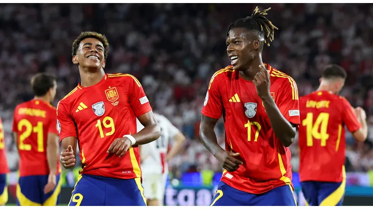 Nico Williams of Spain celebrates scoring his team's third goal with teammate Lamine Yamal during the UEFA EURO 2024 round of 16 match between Spain and Georgia at Cologne Stadium on June 30, 2024 in Cologne, Germany.