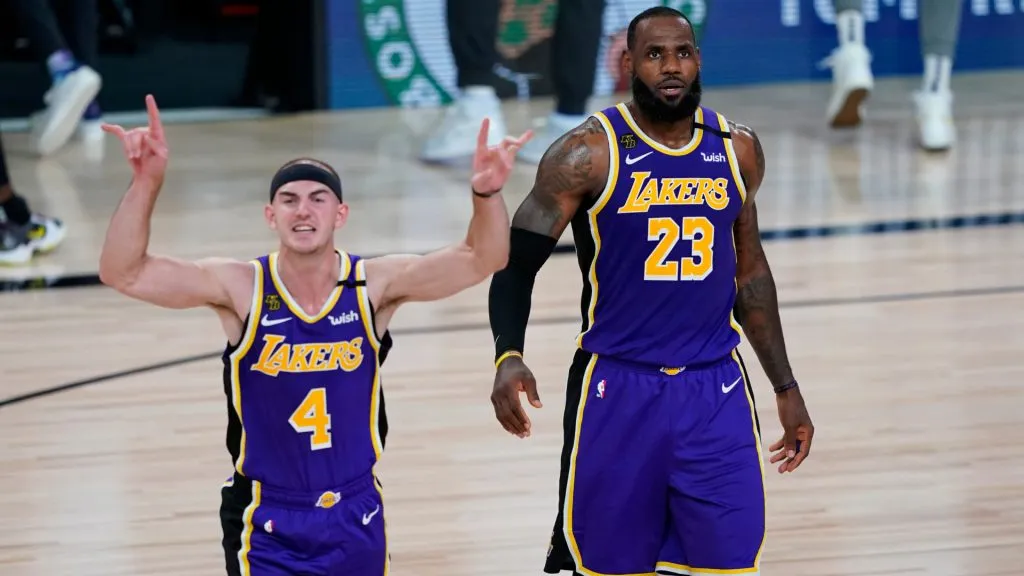 Alex Caruso #4 and LeBron James #23 of the Los Angeles Lakers celebrate their win over the Portland Trail Blazers in Game Three of the first round of the playoffs. (Ashley Landis-Pool/Getty Images)