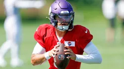 J.J. McCarthy #9 of the Minnesota Vikings participates in a drill during training camp on August 02, 2024 in Eagan, Minnesota.