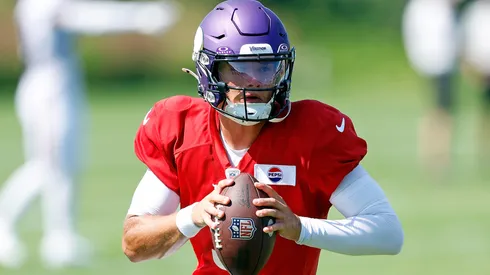 J.J. McCarthy #9 of the Minnesota Vikings participates in a drill during training camp on August 02, 2024 in Eagan, Minnesota.
