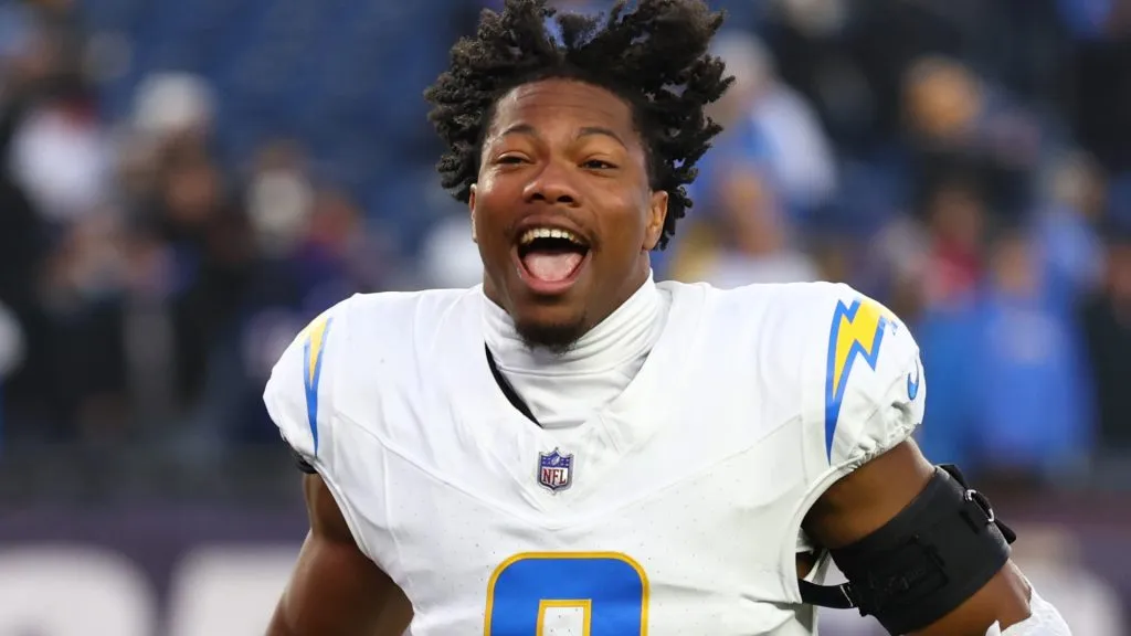 Daiyan Henley reacts after a 40-7 victory against the Patriots