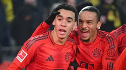 Jamal Musiala of Bayern celebrates scoring his goal with Leroy Sané during the Bundesliga match between Borussia Dortmund and FC Bayern München at Signal Iduna Park on November 30, 2024 in Dortmund, Germany.
