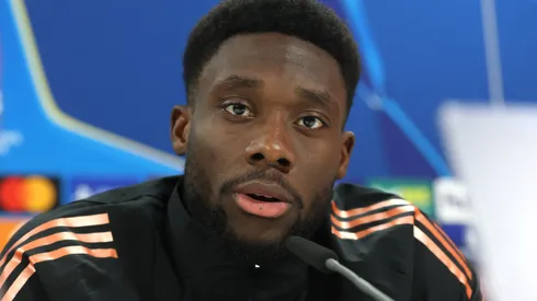 Alphonso Davies of FC Bayern München talks to the media during a press conference ahead of their UEFA Champions League 2024/25 round of 16 first leg match at Bayern Münchens trainings ground Säbener Strasse on March 04, 2025 in Munich, Germany.