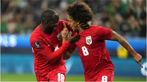 Adalberto Carrasquilla (R) of Panama celebrates with his teammate Cecilio Waterman.