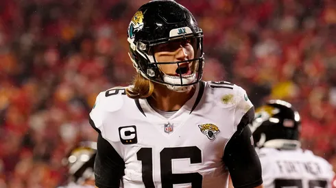 Trevor Lawrence #16 of the Jacksonville Jaguars celebrates a touchdown scored by Travis Etienne Jr. #1 against the Kansas City Chiefs during the fourth quarter in the AFC Divisional Playoff game at Arrowhead Stadium on January 21, 2023 in Kansas City, Missouri.