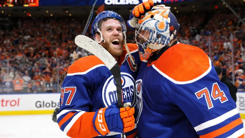Connor McDavid and Stuart Skinner of the Edmonton Oilers celebrate after beating the Dallas Stars 2-1 in Game Six of the Western Conference Final of the 2024 Stanley Cup Playoffs. (Source: Codie McLachlan/Getty Images)
