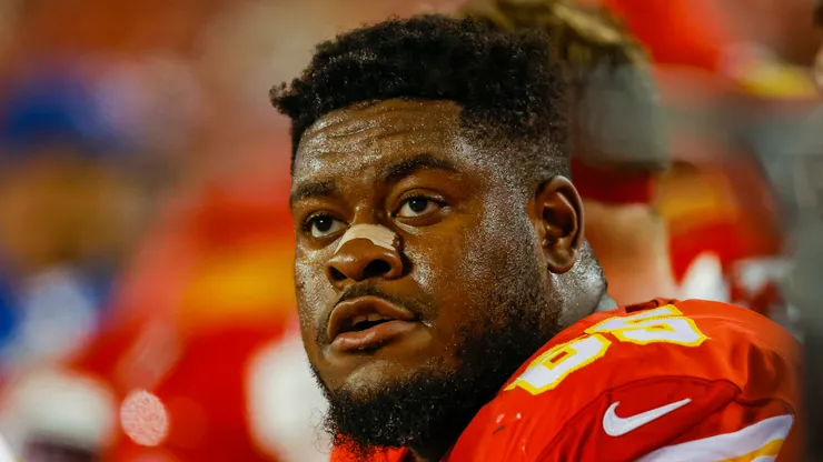 Trey Smith #65 of the Kansas City Chiefs sits on the Chiefs bench during the game against the Denver Broncos at Arrowhead Stadium on December 5, 2021 in Kansas City, Missouri.