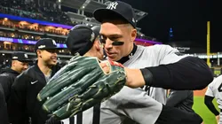 Luke Weaver #30 and Aaron Judge #99 of the New York Yankees celebrate after beating the Cleveland Guardians 5-2 in 10 innings to win Game Five of the American League Championship Series at Progressive Field on October 19, 2024 in Cleveland, Ohio.