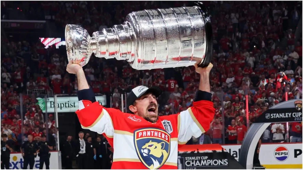 Brad Marchand hoists the Stanley Cup after the Florida Panthers defeated the Edmonton Oilers by a score of 5-1 in Game 6 at Amerant Bank Arena in Sunrise, Florida.