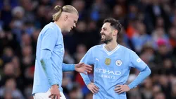 Bernardo Silva of Manchester City celebrates scoring his team's second goal with teammate Erling Haaland during the Emirates FA Cup Quarter Final match between Manchester City and Newcastle United.