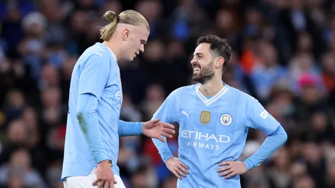 Bernardo Silva of Manchester City celebrates scoring his team's second goal with teammate Erling Haaland during the Emirates FA Cup Quarter Final match between Manchester City and Newcastle United.
