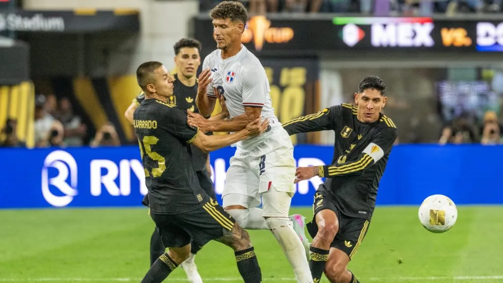 Heinz Morshel #8 of Dominican Republic is defended by Roberto Alvarado #25 and Edson Alvarez #4 of Mexico during the second half of the Gold Cup match on June 14, 2025. (Source: Shaun Clark/Getty Images)