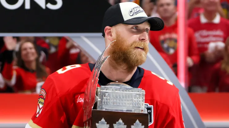 Sam Bennett #9 of the Florida Panthers celebrates with the Conn Smythe Trophy after defeating the Edmonton Oilers in Game Six of the 2025 Stanley Cup Final at Amerant Bank Arena on June 17, 2025 in Sunrise, Florida.