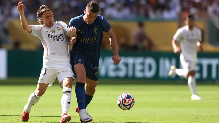 Luka Modric #10 of Real Madrid C.F. battles for possession with Sergej Milinkovic-Savic #22 of Al Hilal during the FIFA Club World Cup 2025 group H match.