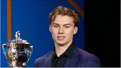 Connor Bedard holds the E. J. McGuire Award of Excellence during the 2023 NHL Awards at Bridgestone Arena on June 26, 2023 in Nashville, Tennessee.