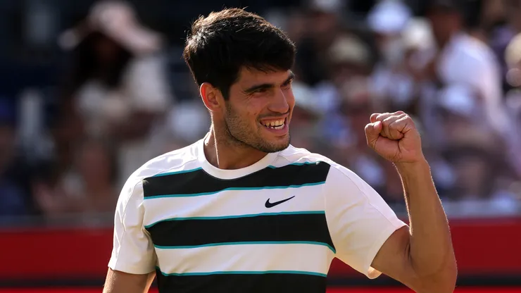 Carlos Alcaraz of Spain celebrates winning match point against Roberto Bautista Agut at Queen's Club.
