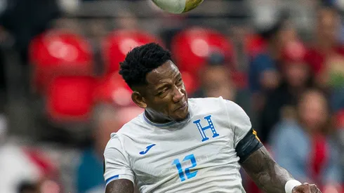 Romell Quioto #12 of Honduras heads a ball after beating Niko Sigur #23 of Canada during the second half of 2025 Concacaf Gold Cup Group B