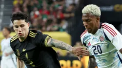 Josimar Méndez #20 of Costa Rica dribbles the ball against Jorge Sánchez #2 of Mexico during the first half of a CONCACAF Gold Cup Group A match at Allegiant Stadium