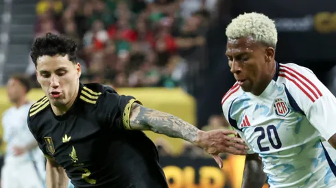 Josimar Méndez #20 of Costa Rica dribbles the ball against Jorge Sánchez #2 of Mexico during the first half of a CONCACAF Gold Cup Group A match at Allegiant Stadium