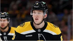 Mason Lohrei #6 of the Boston Bruins looks on during the first period of the game against the Florida Panthers at TD Garden on October 14, 2024 in Boston, Massachusetts.