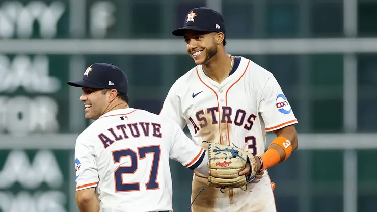 Jose Altuve #27 and Jeremy Peña #3 of the Houston Astros celebrate after their team defeated the New York Mets 3-1 on Opening Day at Daikin Park on March 27, 2025 in Houston, Texas.