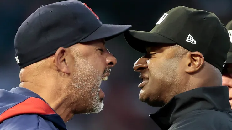Manager Alex Cora of the Boston Red Sox argues with umpire Alan Porter #64 after being ejected in the fifth inning of play against the Los Angeles Angels at Angel Stadium of Anaheim on June 23, 2025 in Anaheim, California.