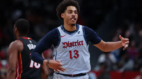 Jordan Poole #13 of the Washington Wizards celebrates after making a three point basket against the Miami Heat during the second half at Capital One Arena on March 31, 2025 in Washington, DC.