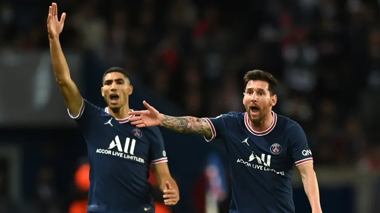 Lionel Messi and Achraf Hakimi of Paris Saint-Germain react during the UEFA Champions League group A match between Paris Saint-Germain and Manchester City.