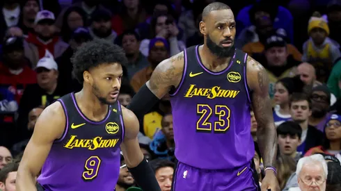 Bronny James #9 stands by LeBron James #23 of the Los Angeles Lakers during the second half against the Philadelphia 76ers at the Wells Fargo Center on January 28, 2025 in Philadelphia, Pennsylvania.