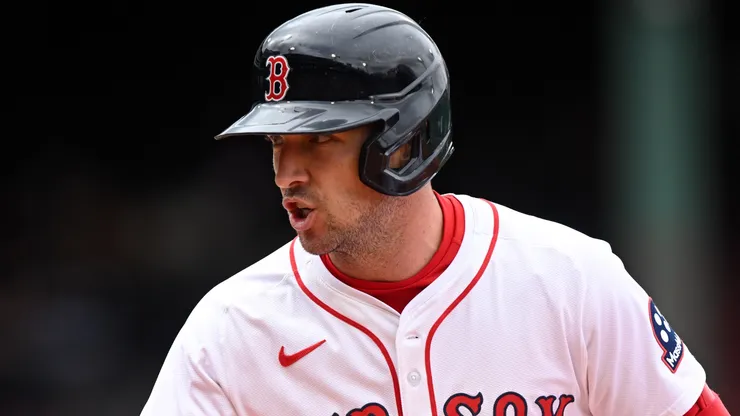 Alex Bregman #2 of the Boston Red Sox calls to the dugout for a trainer.